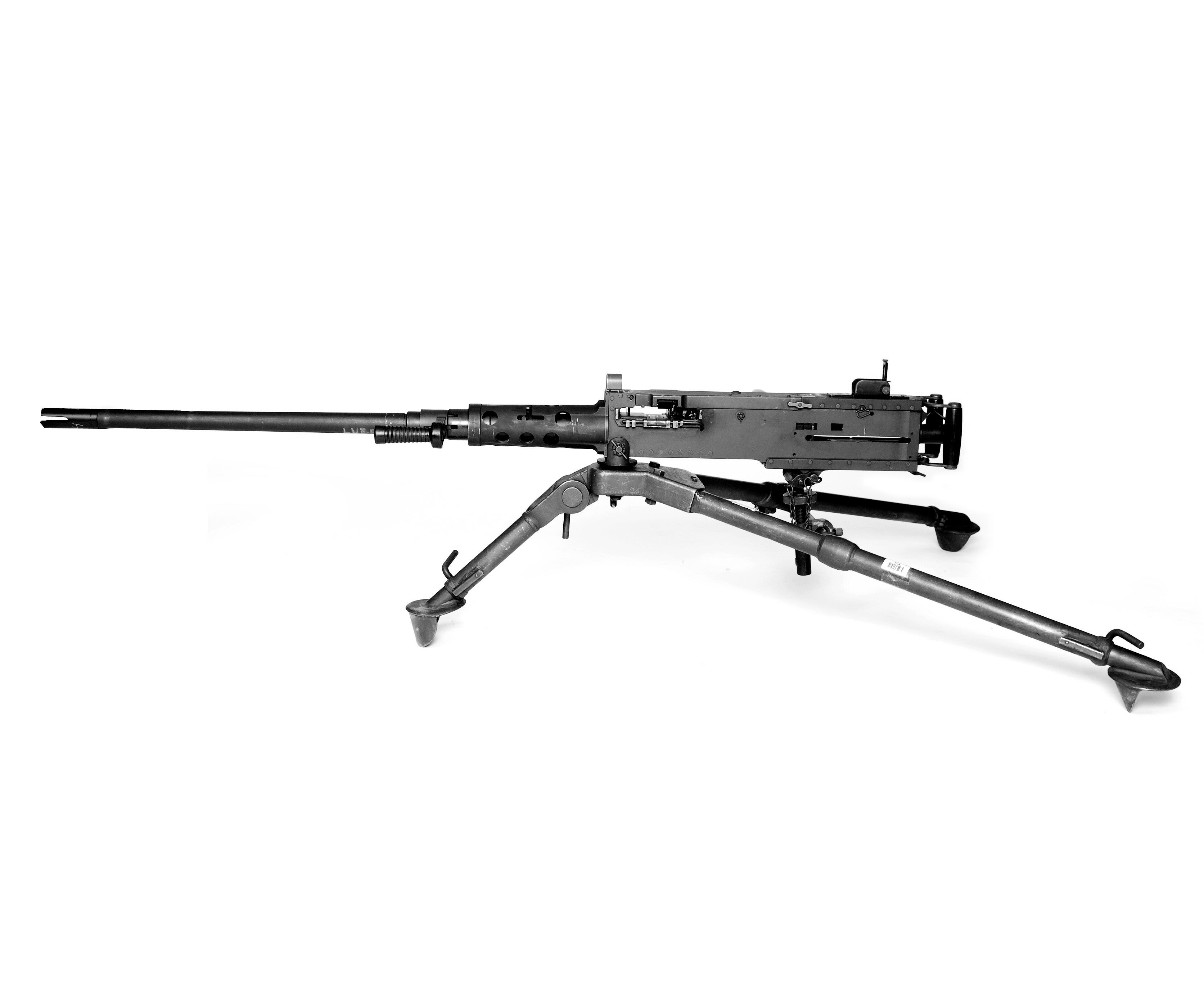Machine gun including tripod against a white background