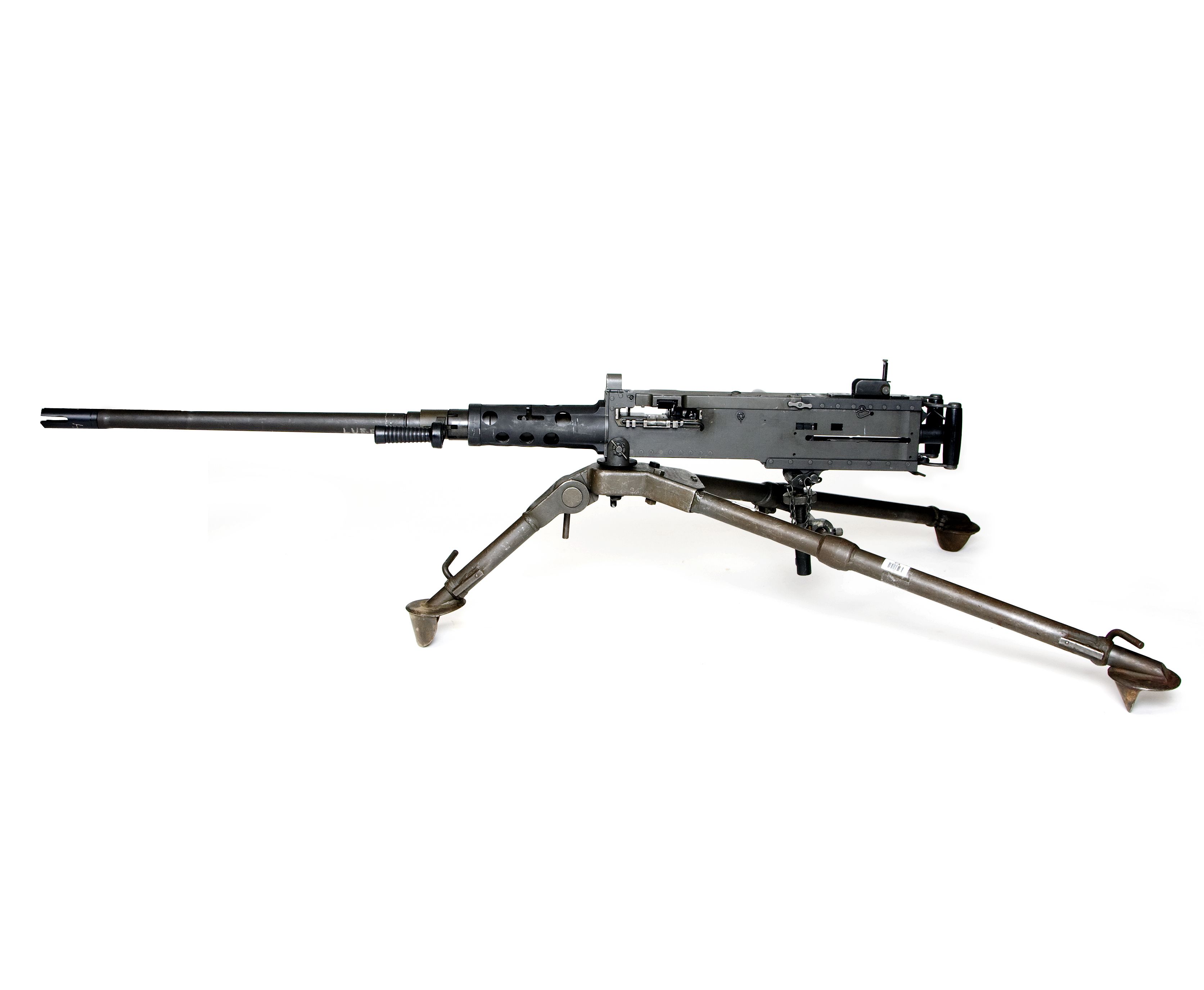 Machine gun including tripod against a white background